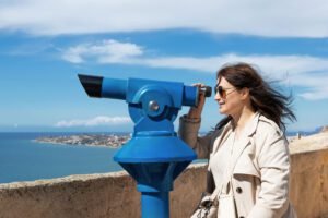 close up woman looks through a tourist telescope 2025 09 09 23 42 12 utc