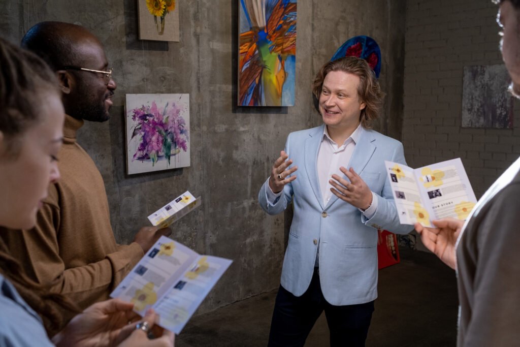 happy artist interacting with guests of exhibition 2025 03 13 13 54 15 utc scaled