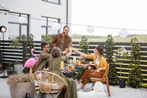 young friends dining at backyard of the country ho 2025 03 16 06 54 18 utc