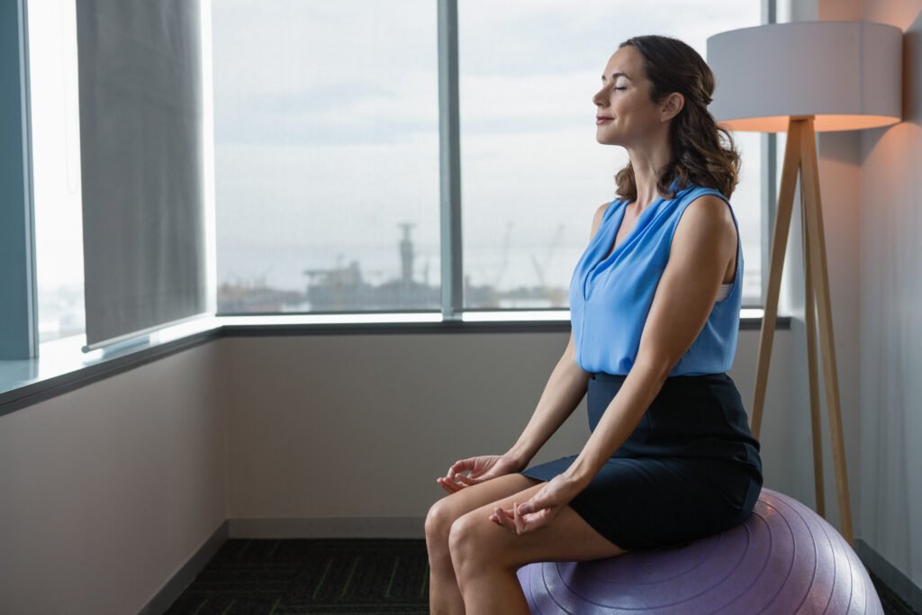 executive meditating on fitness ball 2025 04 03 13 28 33 utc scaled