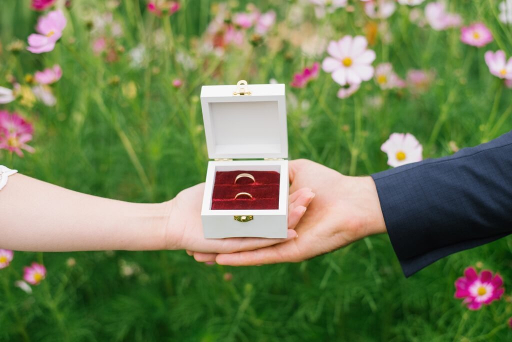 wedding rings in a box on the palms of the bride a 2025 03 09 12 18 54 utc scaled