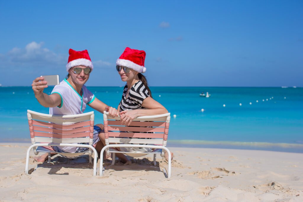 young happy couple in red santa hats taking a phot 2025 02 11 15 52 43 utc scaled