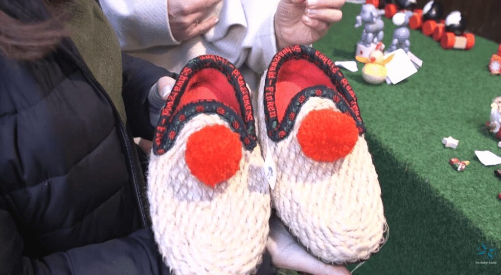 Handmade Black Forest “witch shoes” crafted from natural fibers displayed at a Freiburg market stall.
