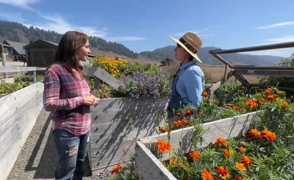 Karen speaks with Felicia, Otis’s wife, in the flower garden on the Mendocino Coast.