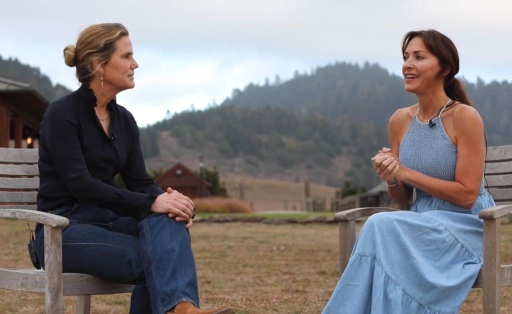 Karen and Blaire talk outside the Inn at Newport Ranch with the Mendocino Coast hills behind them.
