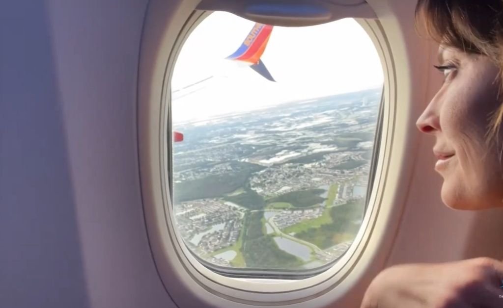 Karen LeBlanc looking out the airplane window during her flight into San Francisco, the starting point of her journey to the Mendocino Coast.