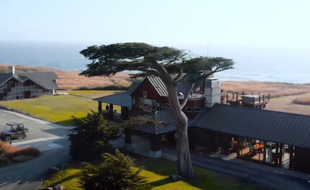 The Inn at Newport Ranch with its iconic Monterey cypress tree standing beside the lodge overlooking the Mendocino Coast.