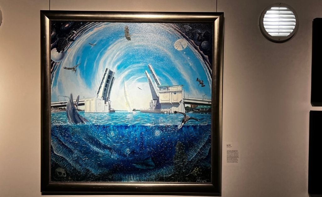 Large framed acrylic painting of John’s Pass showing a split drawbridge over blue water, with dolphins, birds, and swirling sky imagery by Don Gillespie.