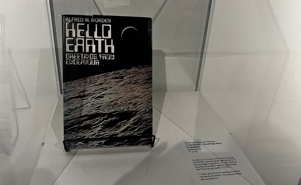 Book titled Hello Earth: Greetings from Endeavour by Apollo astronaut Alfred M. Worden, displayed at Orlando Science Center. Hello Earth: Greetings from Endeavour by Apollo astronaut Alfred M. Worden. Hello Earth: Greetings from Endeavour by Apollo astronaut Alfred M. Worden. Hello Earth: Greetings from Endeavour by Apollo astronaut Alfred M. Worden.