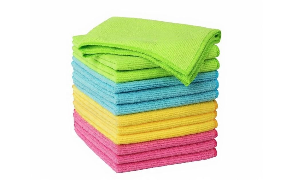 Stack of colorful microfiber cleaning cloths folded neatly on a white background