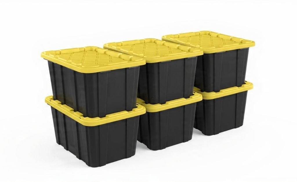 Stacked black storage bins with yellow lids arranged on a white background