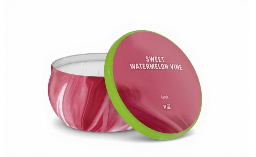 Pink marbled candle jar with lid labeled sweet watermelon vine