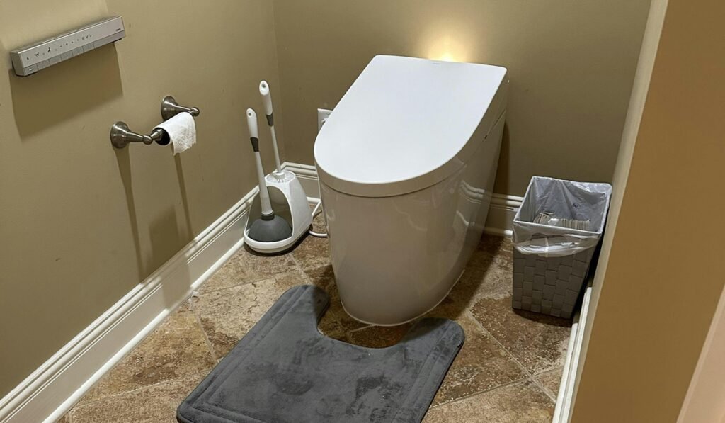 Sleek white smart bidet toilet in a modern bathroom