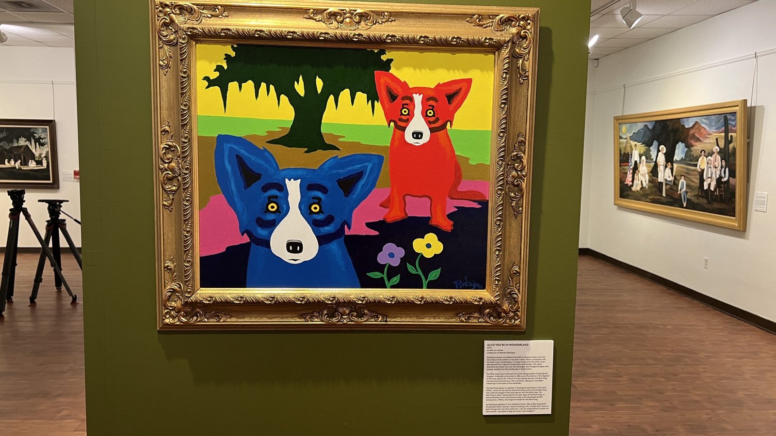 n original George Rodrigue Blue Dog painting set against a South Louisiana landscape